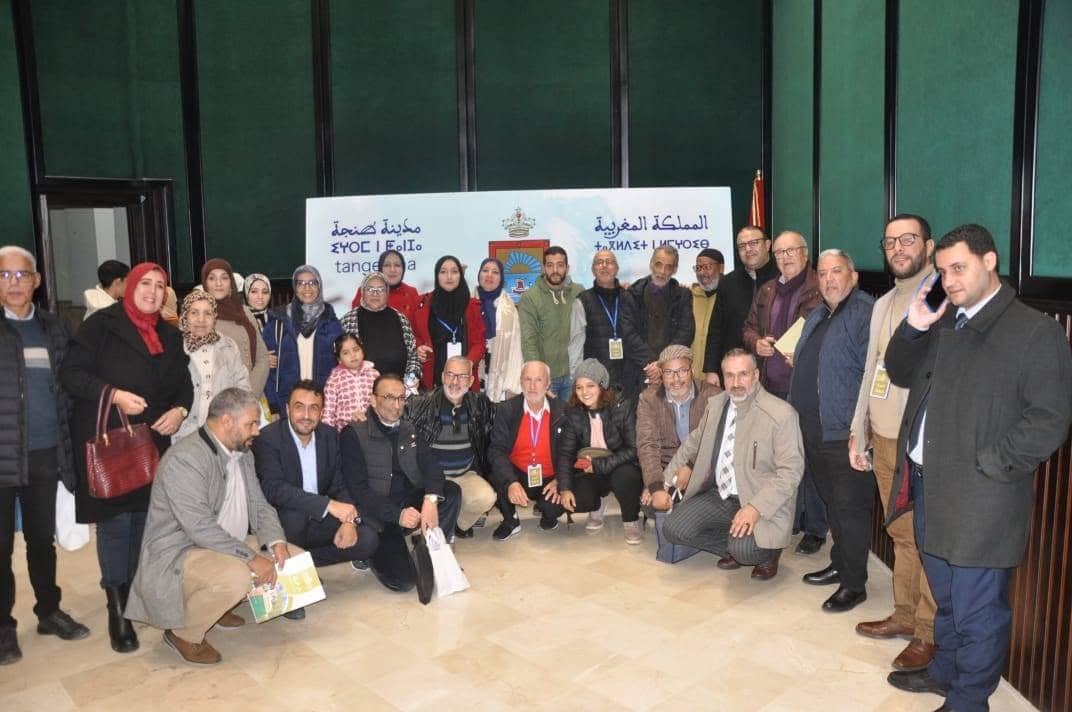 Audience and speakers at a research event